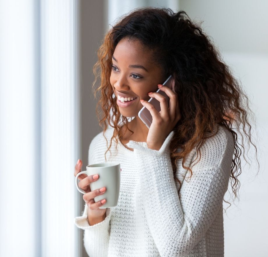 Customer on the phone asking common business questions handled by SmileSuite virtual receptionist and call answering service